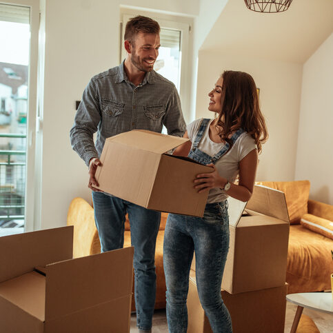 Engaged couple moving into new apartment